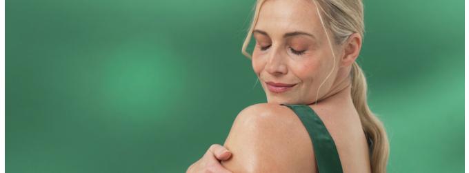 Lady smiling and smelling our products