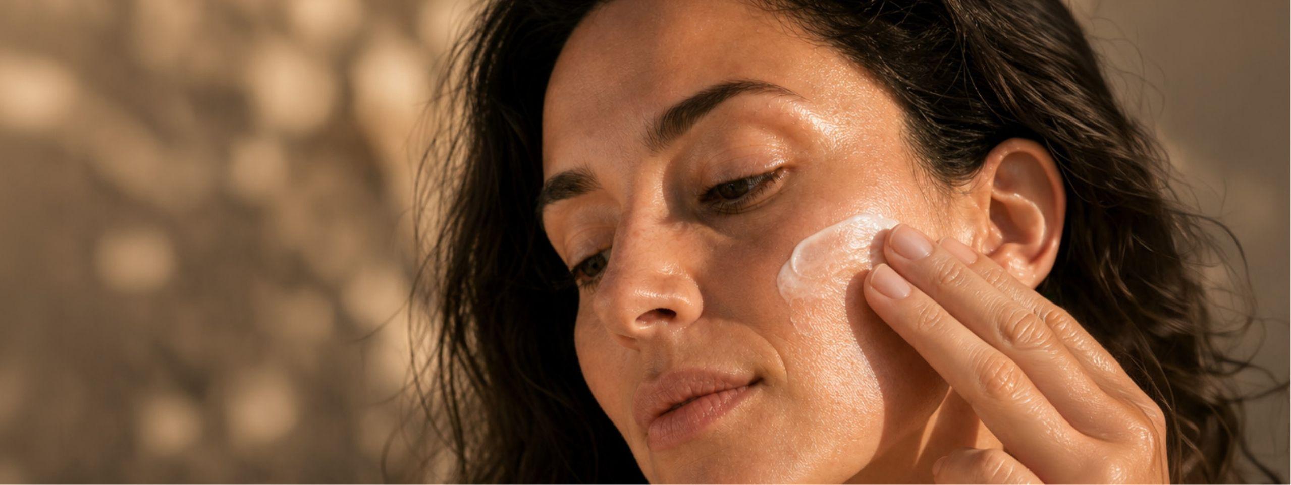 A lady massaging REPOSE Relaxing Night Cream from TEMPLESPA into her face.