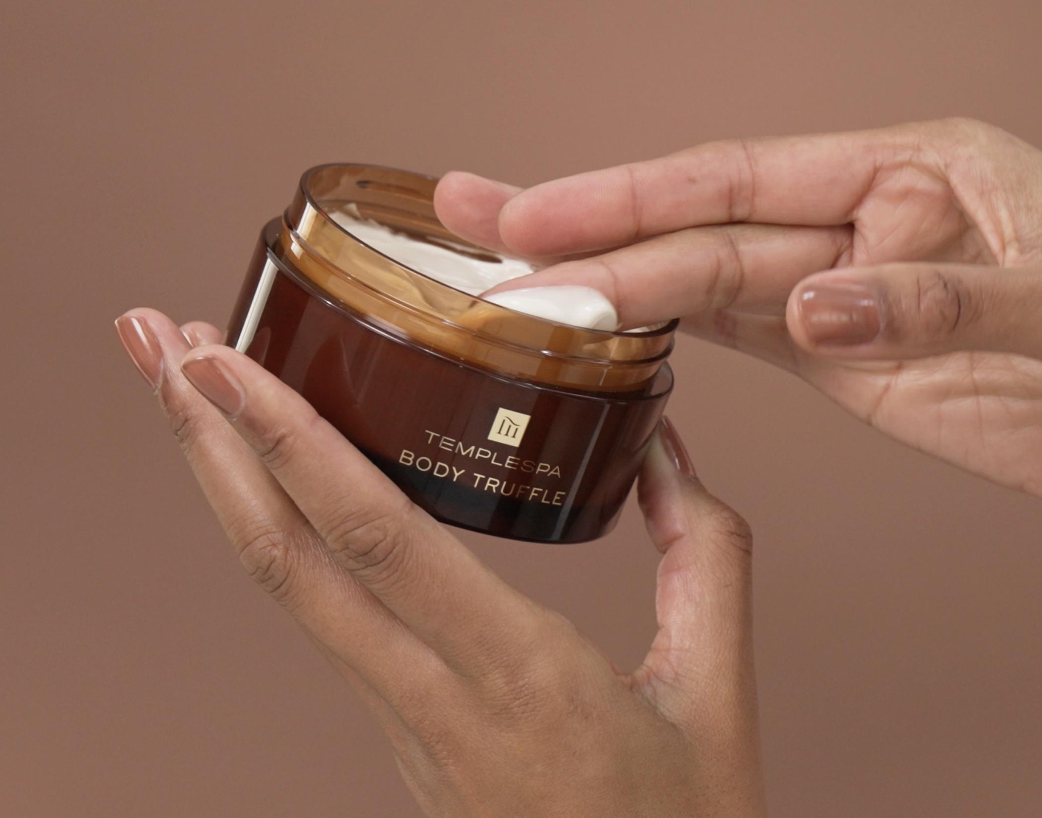 Women applying our glowing well primer