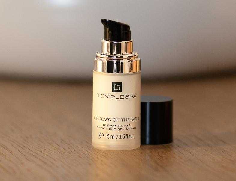 lady applying windows of the soul with her fingertips around her eye