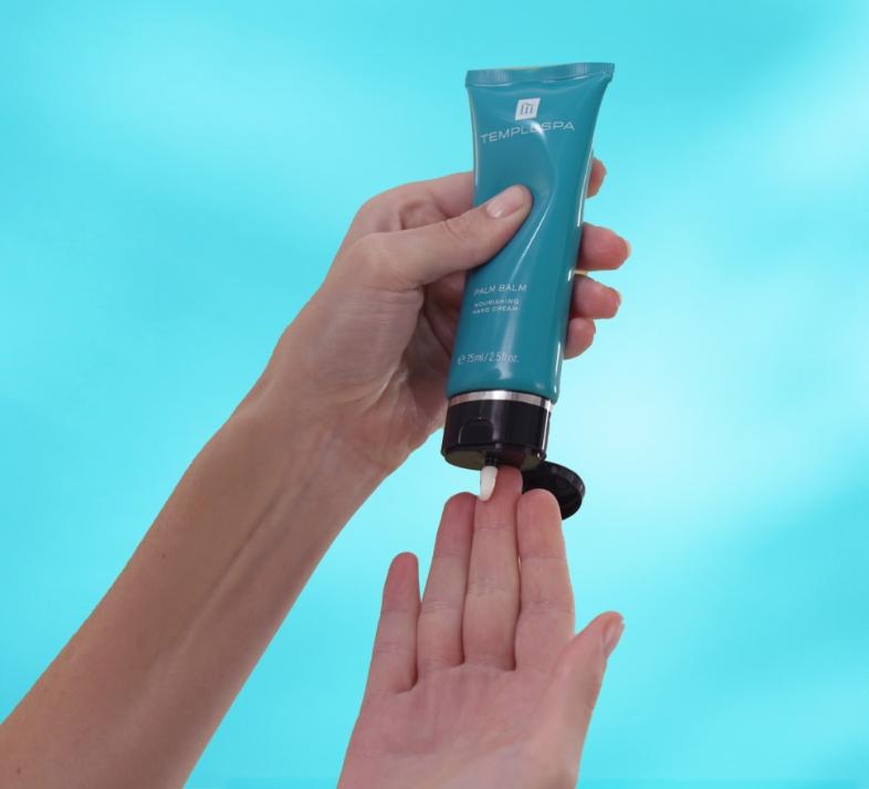 Women applying our glowing well primer