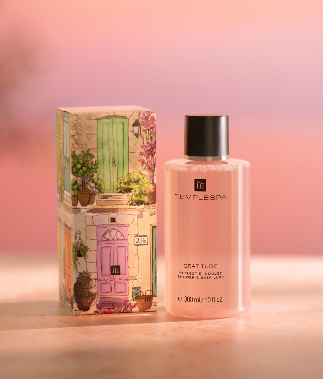 Gatitude bath and show luxe infront of a pink sunset background